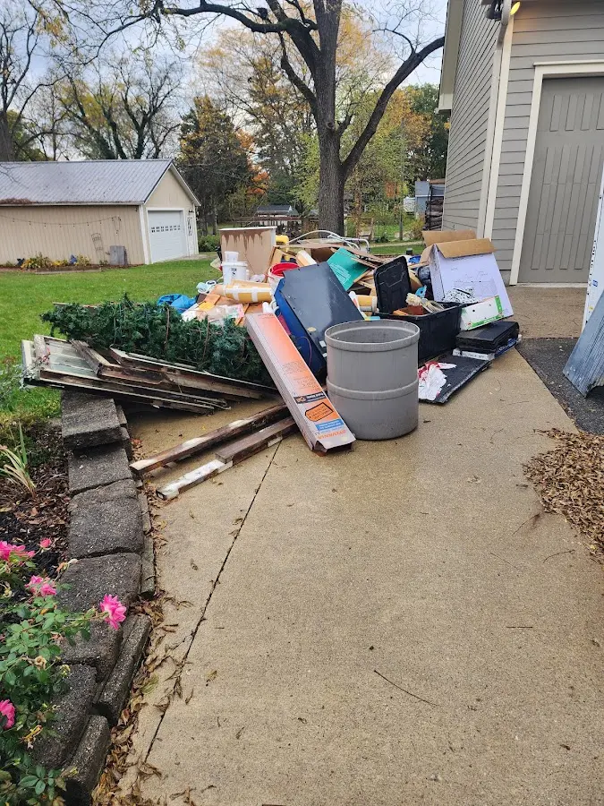 Dumpster being loaded with debris for Roofing Dumpster Rental in Kochville